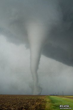 A strong tornado narrows in width south of Dodge City, Kansas