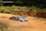 Destroyed car in creek bed