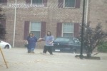 People evacuate flooded apartments