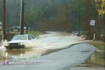 Cars risk trip through floodwater