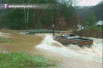 Cars risk trip through floodwater