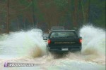 Cars risk trip through floodwater