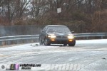 Car tries to climb icy hill
