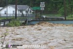 Flood rises to base of bridge