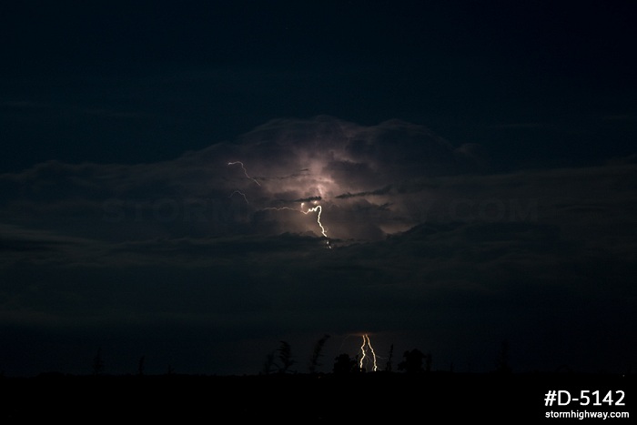 Moonlit distant storm and lightning