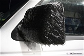Freezing rain ice on rearview mirror