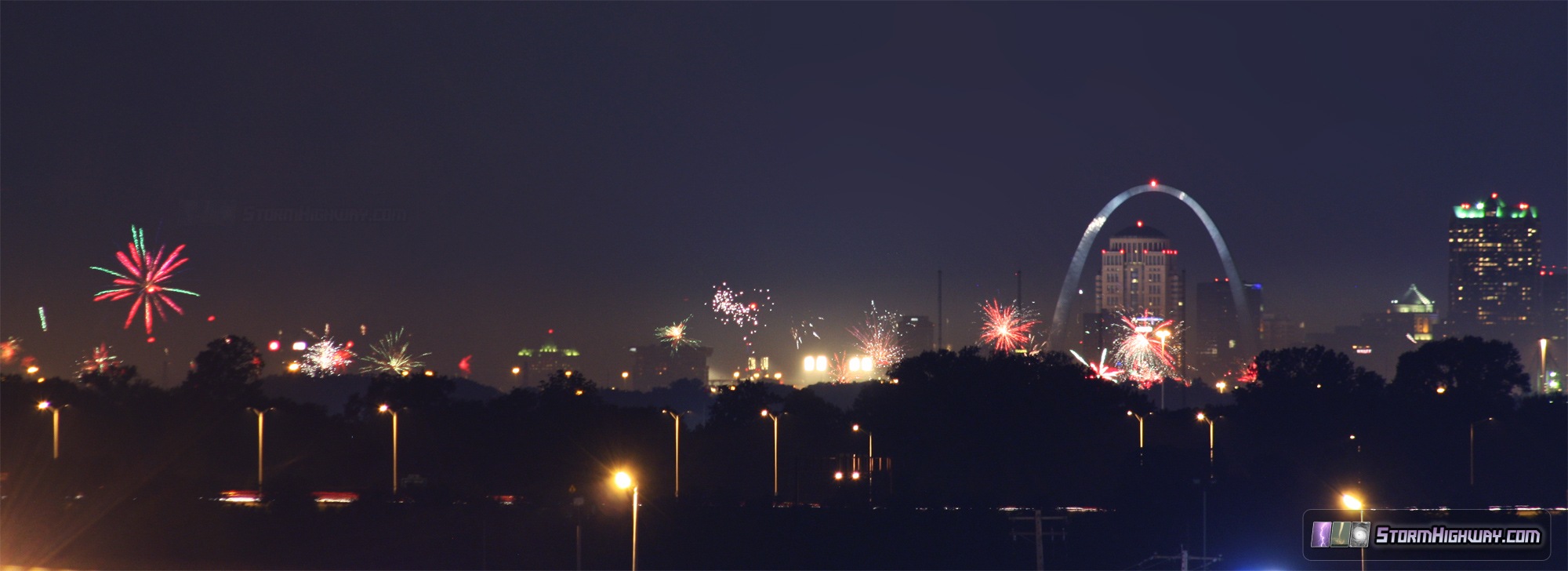East St. Louis fireworks with Arch - July 4, 2014