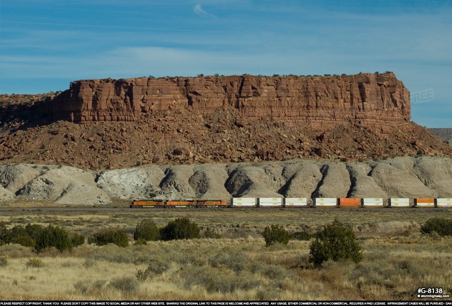BNSF double-stack train in front of a mesa on the southern end of the Tohajiilee reservation west of Albuquerque, New Mexico