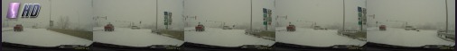 Minivan knocks over traffic light in snowstorm