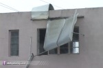 Awnings rip from a building in Fort Pierce