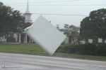 Awnings rip from a building