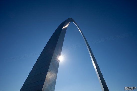 Blue sky and glinting sun at the Gateway Arch in St. Louis