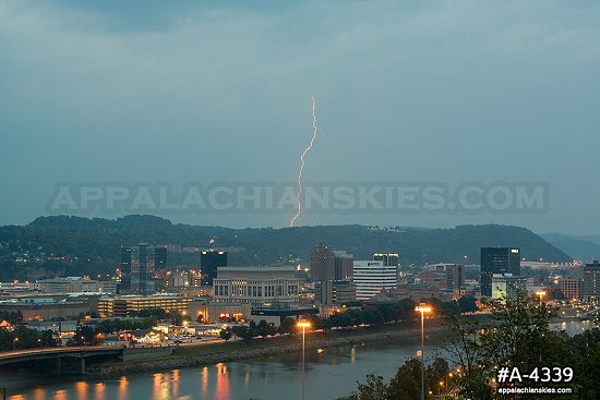 Single lightning bolt behind Charleston skyline