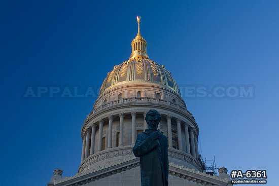 State Capitol and Lincoln statue at sunset
