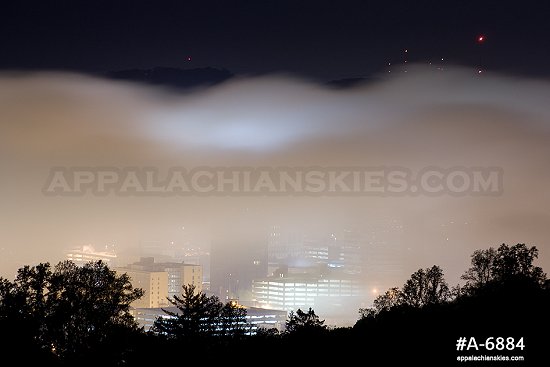 Valley fog at night over downtown