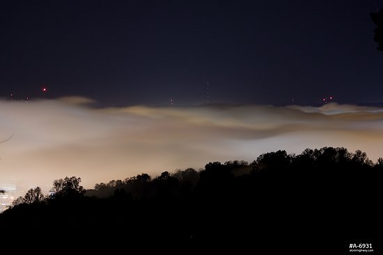 Valley fog at night over downtown