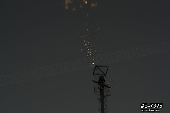 Extreme close-up of lightning striking tower with sparks