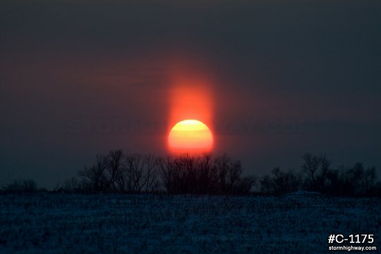 Winter sun pillar at sunset