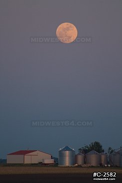 Moonrise over rural Illinois farmland