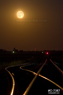 Moonrise over rural railroad