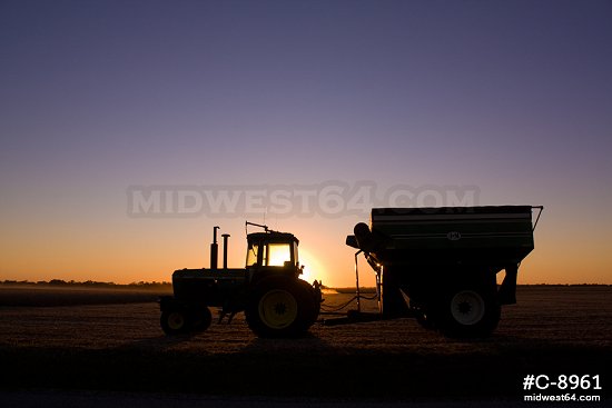 Tractor in field at sunset 2