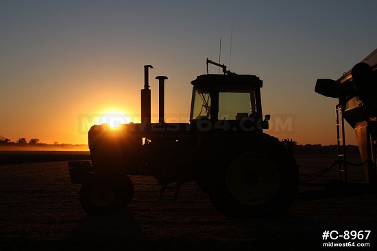 Tractor in field at sunset 1