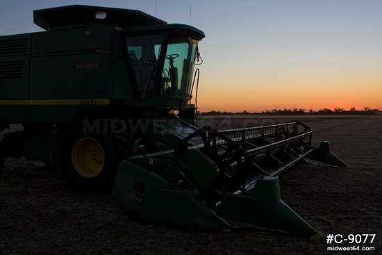 Combine harvester at twilight
