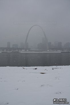 Riverfront view of heavy snow