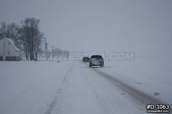 Traffic in prairie snowstorm