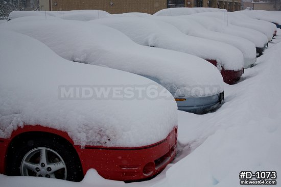 Cars buried in snow after snowstorm
