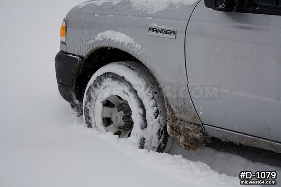 Truck wheel in deep snow