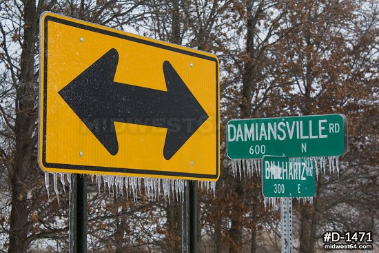 Thick icicles on road signs after an ice storm