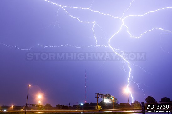 Lightning around a TV tower at night 