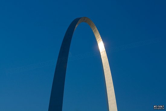 Blue sky and sunlight reflecting in the Gateway Arch