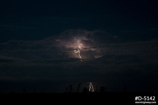 Moonlit distant lightning and thunderstorm at night