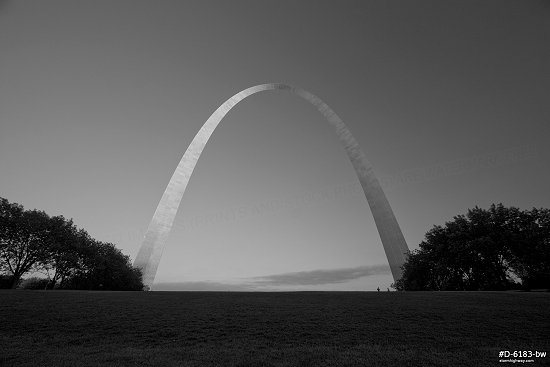 Blue sky over the Gateway Arch and grounds on a late summer evening in St. Louis, black and white