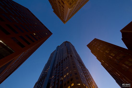 Looking skyward at buildings from a downtown St. Louis intersection at twilight