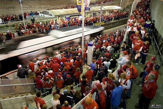 Red crowds at the Stadium Metrolink station