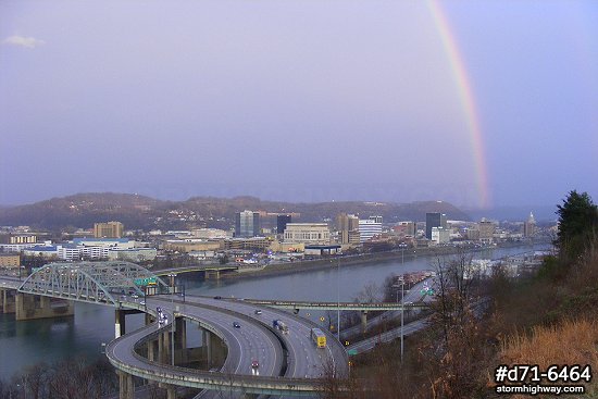 Bright rainbow over Fort Hill bridge and downtown Charleston