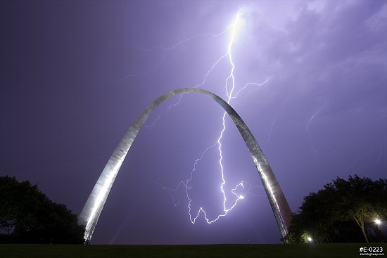 Lightning filling the sky over the Gateway Arch at night