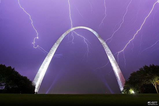Lightning filling the sky over the Gateway Arch at night