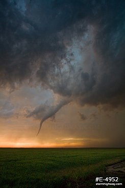 Occluding tornado over the prairie at sunset near Rozel, Kansas