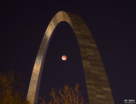 Lunar eclipse with Arch and trees