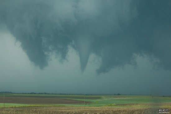 Contorted tornado develops and its funnel descends near Dodge City, Kansas