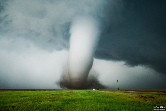 A violent tornado with debris less than a mile away near Dodge City, Kansas