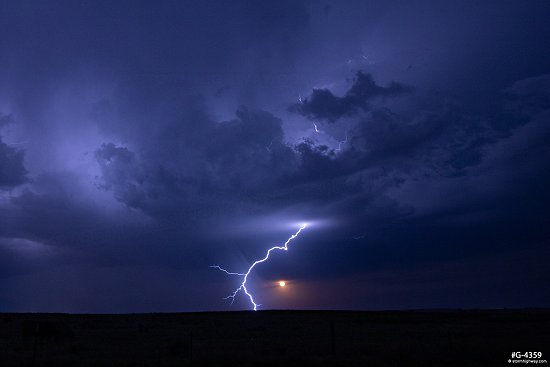 Lightning with the rising moon at Arnett, Oklahoma