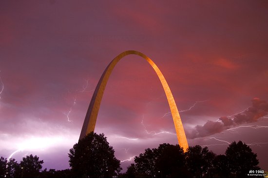 Lightning over the Gateway Arch in St. Louis, MO with sunset colors