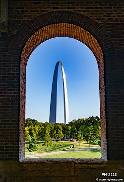 Gateway Arch through arched brick structure at Laclede's Landing