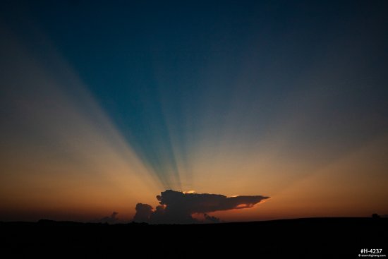 Distant storm crepuscular rays
