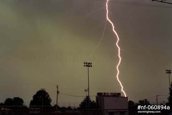 Close ribbon lightning over a football field